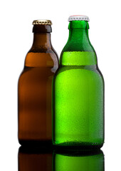 Green and brown beer bottles with dew on white on white background