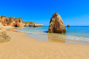 Sandy beach Dos Tres Irmaos summer view(Portimao, Alvor, Algarve, Portugal).