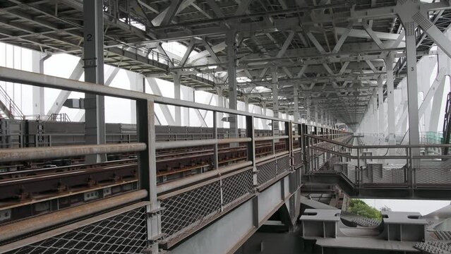 Kagawa, Japan - June 25, 2023: A train passing Seto-Ohashi Bridge

