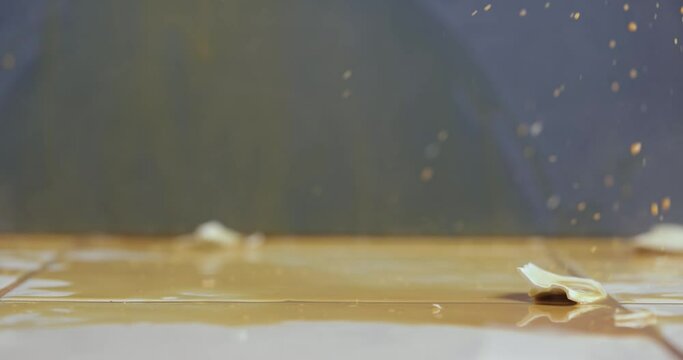 Dropped cup of coffee hitting the floor breaking