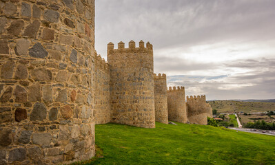 Fototapeta na wymiar Walls of the historic city of Avila,at the blue hour, in Spain. the old city of Avila and its extramural churches were declared a World Heritage site by UNESCO