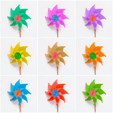 Collage of colorful pinwheels on white paper background