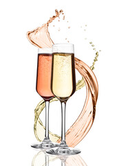 Glasses of yellow and pink champagne with splashes and bubbles on white background