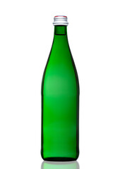 Green bottle of sparkling mineral water on white background