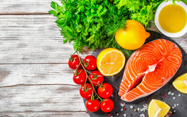 portion of fresh salmon steak with aromatic herbs, close-up