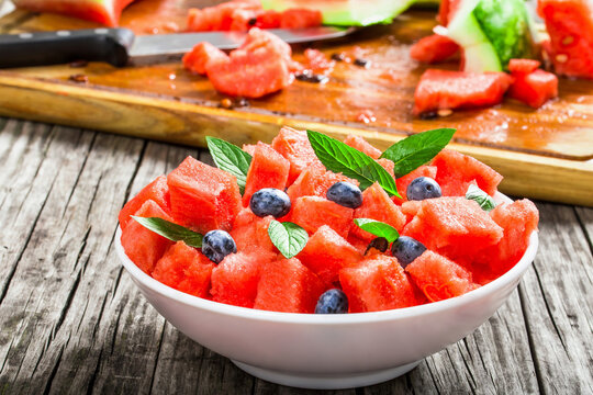 watermelon with blueberries and fresh mint , selective focus