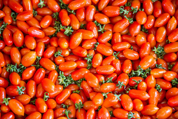 Fresh red tomato background in the market