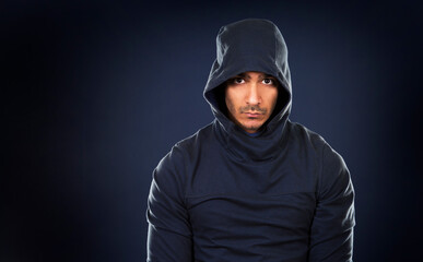 young fit indian man wearing dark workout outfit