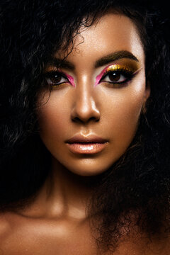 Portrait of a sensual young African woman with colored make up