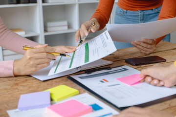 Group of creative meeting, hands of business marketing design and planning project on desk in office.