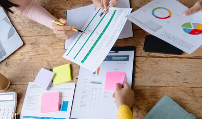 Group of creative meeting, hands of business marketing design and planning project on desk in office.