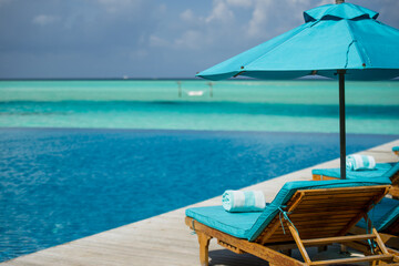Chaise lounge in Maldivian resort with sea view