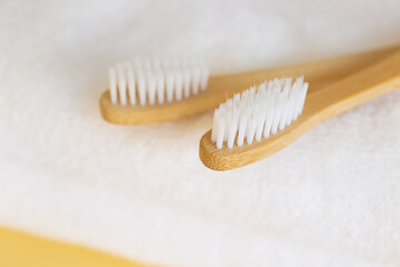 Bamboo tooth brushes on towels, closeup