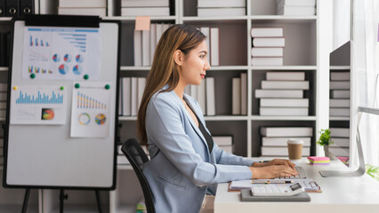 Businesswoman working to typing data on computer while analysis about strategy of business project