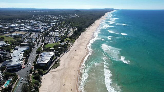 Blue Ocean Waves And Sandy Shore Of Coolum Beach In Queensland, Australia - aerial panoramic