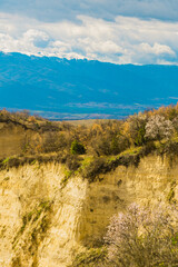 Fototapeta na wymiar Flowering of dogwood and apple tree in early spring in sandy rocks near Melnik Bulgaria