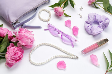 Composition with stylish female accessories, lipstick and beautiful peony flowers on white background