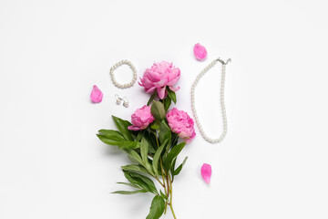 Composition with stylish female accessories and beautiful peony flowers isolated on white background