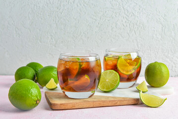 Glasses of cold Cuba Libre cocktail on table