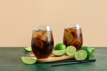 Glasses of cold Cuba Libre cocktail on table