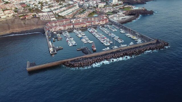 Bouldered rocky shores of port Los Gigantes Harbour Spain