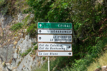 street sign with arrow in the Vosges region to EPINAL, GERARDMER, LE HOHNECK, LE LAC BLANC AND COL...