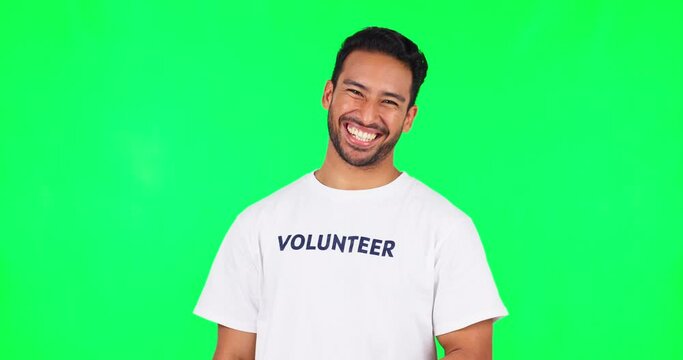 Join us, volunteer and man on green screen for charity, helping and support in community service or nonprofit. T shirt, you sign and happy face of young asian person with offer on a studio background