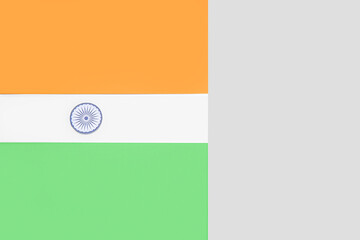 Indian flag made of paper on grey background