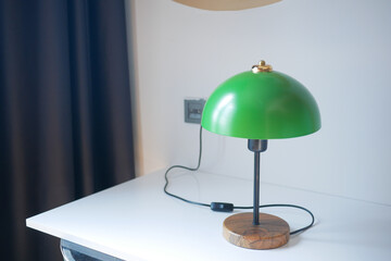 a ltable amp in home against white wall 