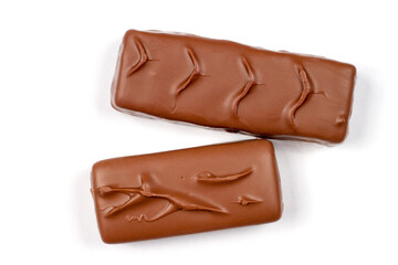 Two chocolate bars on a white background. Close-up chocolate bars with filling.