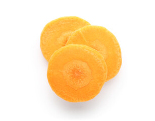 Slices of fresh carrots on white background