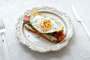 Breakfast Toast with Fried Eggs, Avocado and Bacon