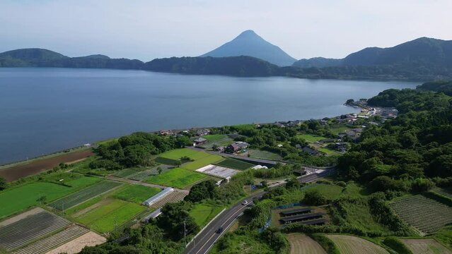 Aerial drone footage of the Kaimon volcano and the rural landscape around the lake Ikeda in Kyushu in Japan