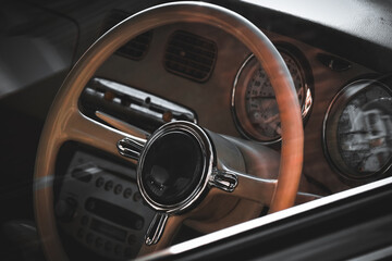 Fototapeta premium Close up of the steering wheel of a retro vehicle