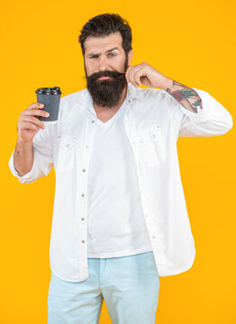 image of barista man with coffee isolated on yellow background