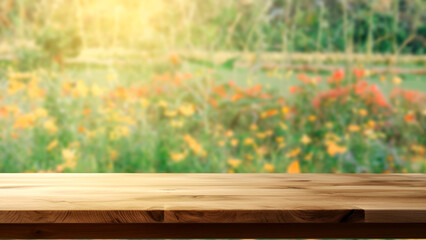 Empty wooden table with blurred flower garden background. The empty space can be used for montage or product and advertising display designs