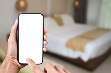 Hand holding black smartphone with transparent screen  and  bedroom background, Mobile phone frameless design application booking hotel concept and PNG file