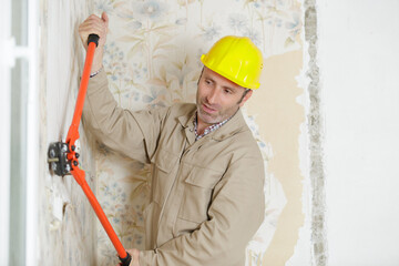 male worker demonstrates a secateur