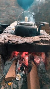 Aesthetic traditional kitchen with stove and kettle, smoke, cooking