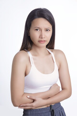 Asian woman suffering from a stomach ache on white background