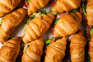 croissants with ham on catering table