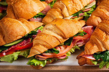croissants with ham on catering table