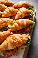croissants with ham on catering table