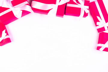 background with red festiv boxes with ribbons and bows or gifts on white background,concept for new...