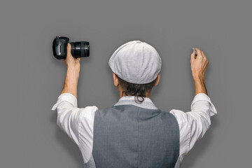 Fototapeta premium Qualified male photographer giving training program for photographers on gray background