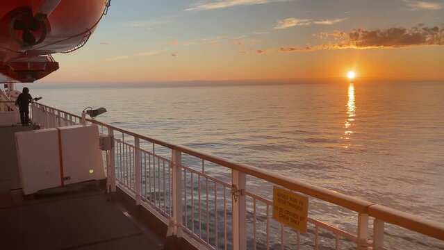 Hurtigruten ship sails across the Arctic Ocean in the glow of the midnight sun, tourism, transport, Arctic, Finnmark, Norway, Europe