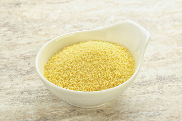 Raw couscous in the bowl
