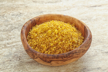 Raw bulgur in the bowl