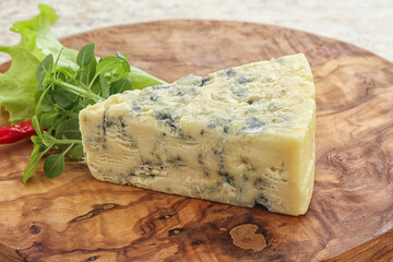 Blue cheese piece over board