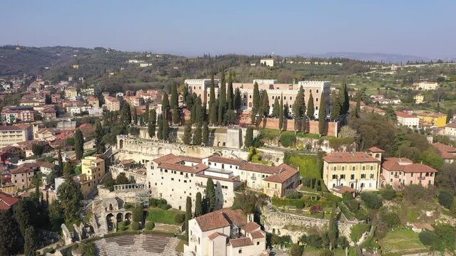 Aerial shot from flying drone of a developed Castel San Pietro in Verona city